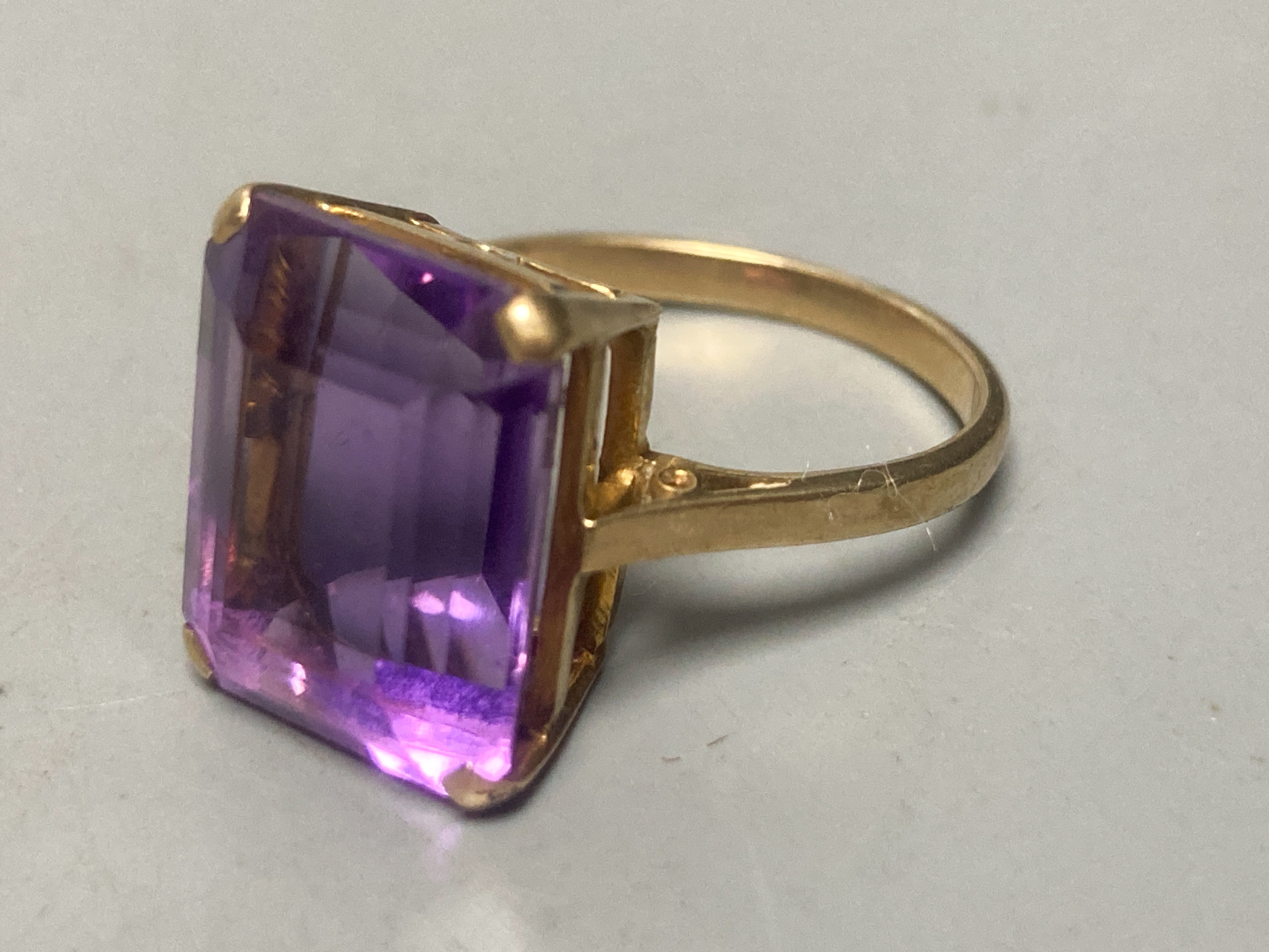A Victorian 15ct gold buckle ring, size P/Q, 4.2 grams, three yellow metal and gem set dress rings, including amethyst, citrine and green tourmaline, gross 21.1 grams, an 18k deity pendant, 3.1 grams and a white metal an